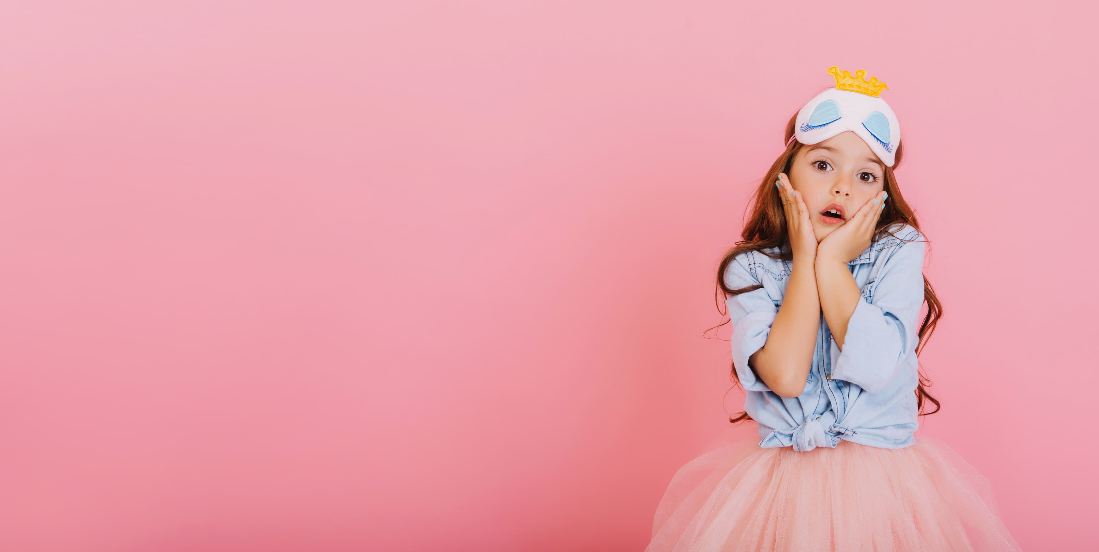 Young girl in a denim shirt and tulle skirt